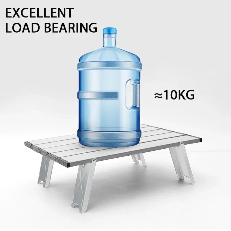 Foldable mini camping table in silver aluminum alloy set up outdoors for a picnic or barbecue — view 5