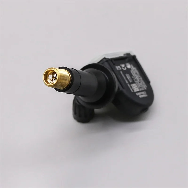 Four black tire pressure monitoring system sensors for vehicle safety and maintenance — view 3