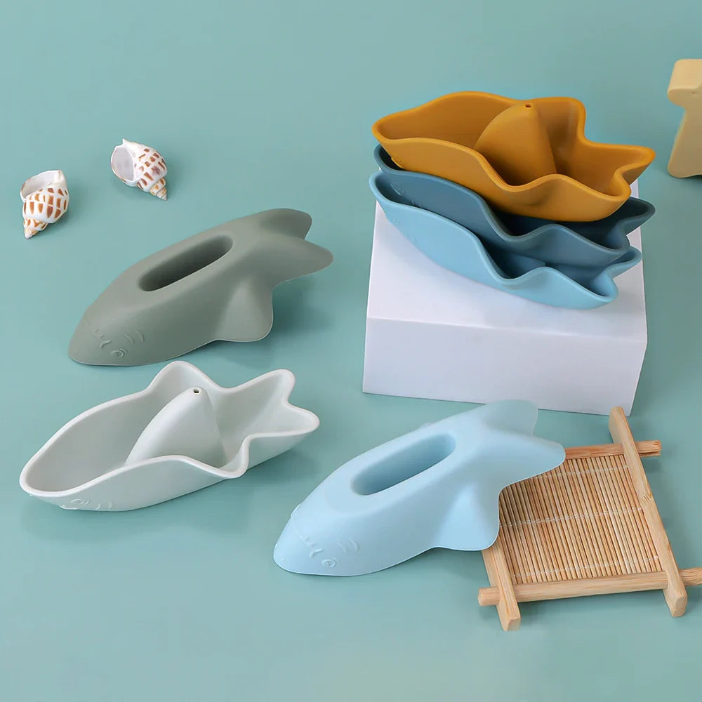 Silicone shark bath toy set of three in soft oceanic colors stacked for compact storage — view 3
