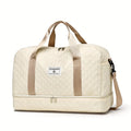 Large beige nylon travel duffel bag with handles and zipper closures for weekend trips