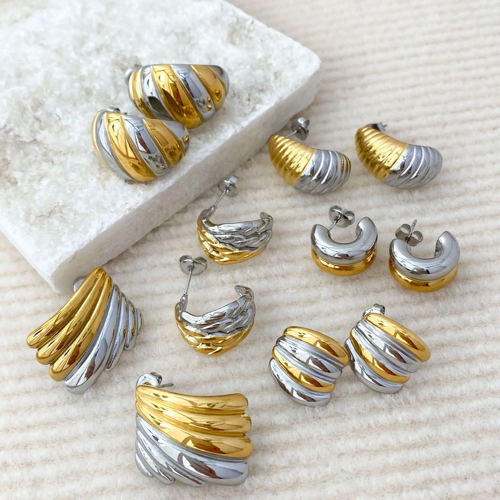 Gold plated geometric stud earrings made of hypoallergenic stainless steel on a clean background