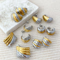 Gold plated geometric stud earrings made of hypoallergenic stainless steel on a clean background