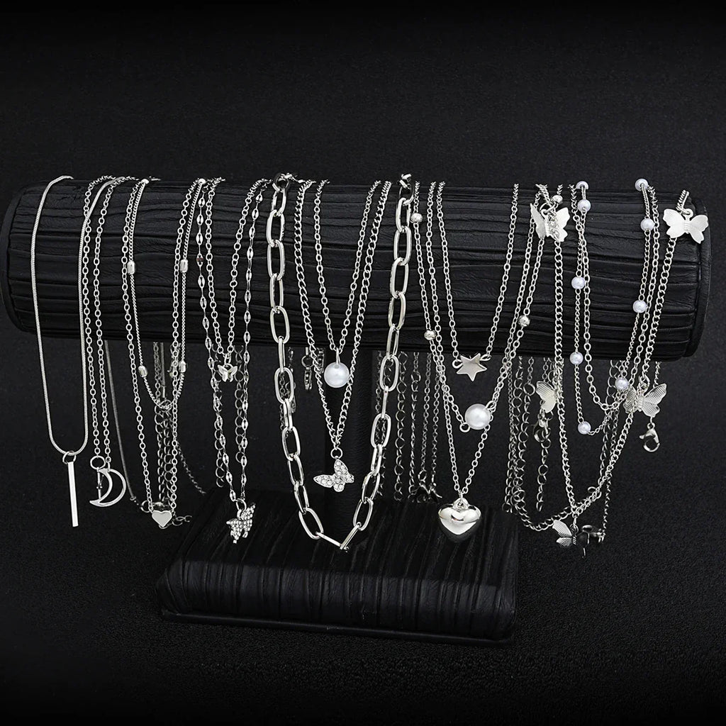 13-piece women's silver tone necklace set featuring heart, star, butterfly, and pearl charm pendants — view 3