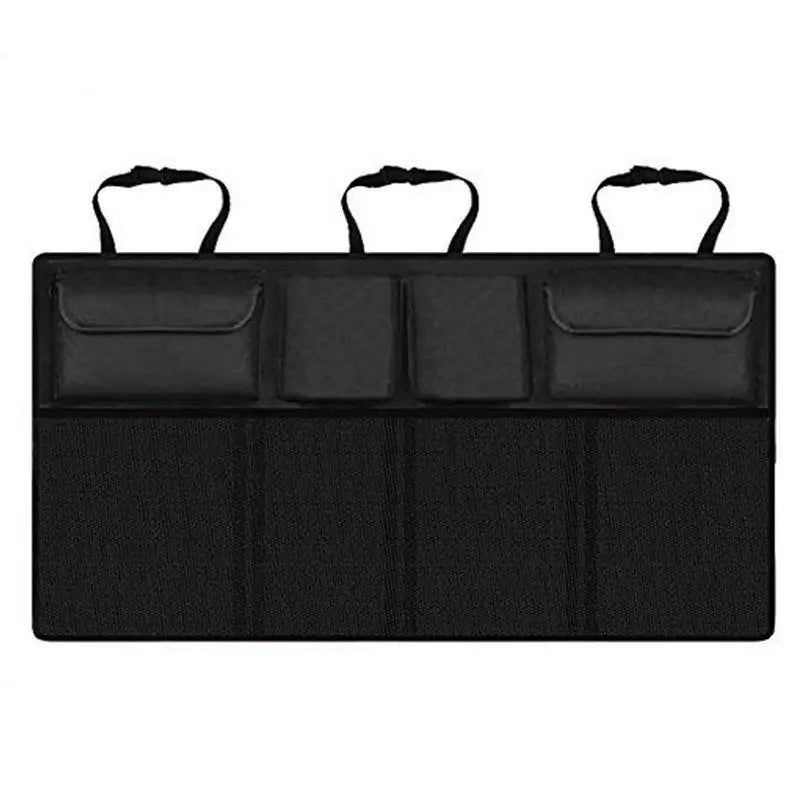 Black hanging car trunk organizer with 8 large storage pockets attached to vehicle backseat headrests