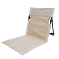 Beige foldable camping chair with padded cushion and compact storage bag for outdoor adventures