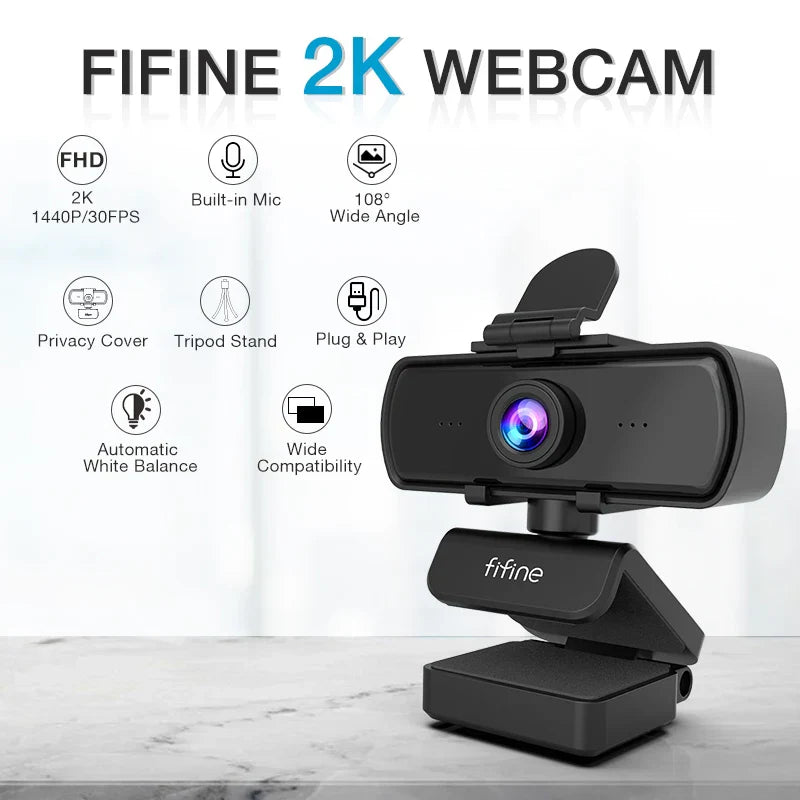 Black 1440p Full HD USB webcam attached to a small adjustable desktop tripod with cable — view 2