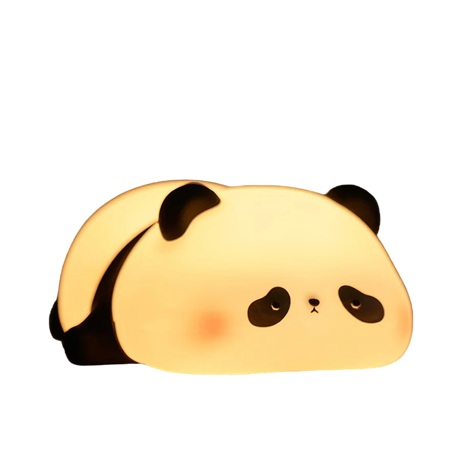 Cute panda silicone LED night light emitting a warm glow on a bedside table