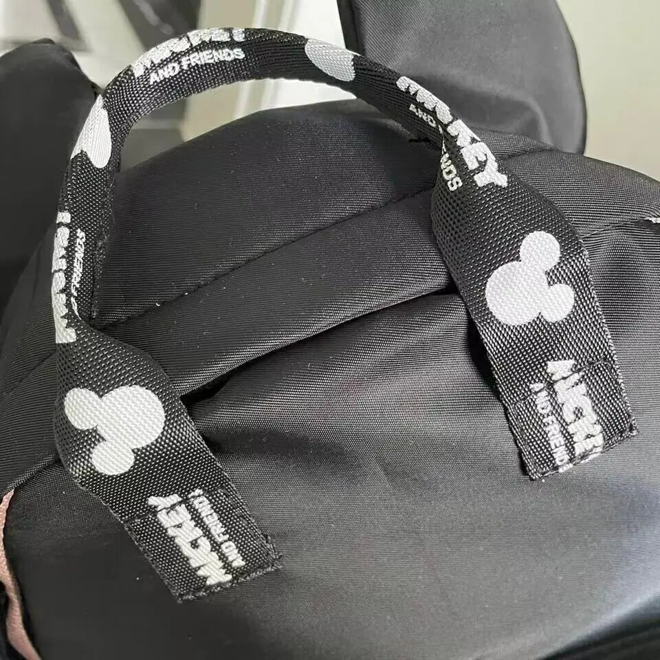 Luxury kids school backpack featuring Mickey Mouse design with raised ears and zippered front pocket — view 2
