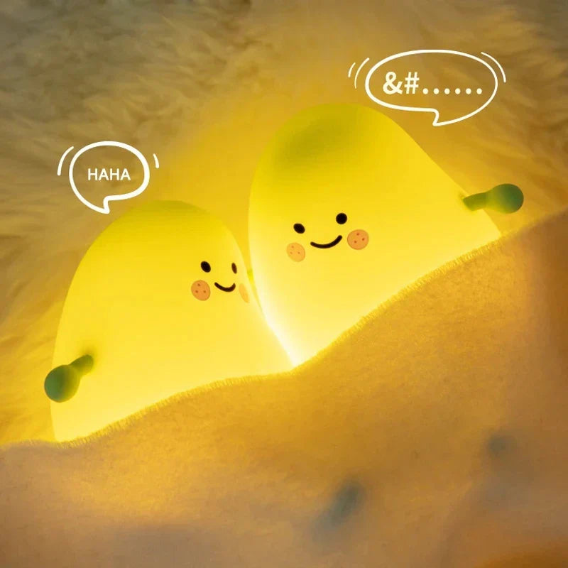 Cute mango night light made of soft silicone emitting a warm glow for bedside decor — view 5