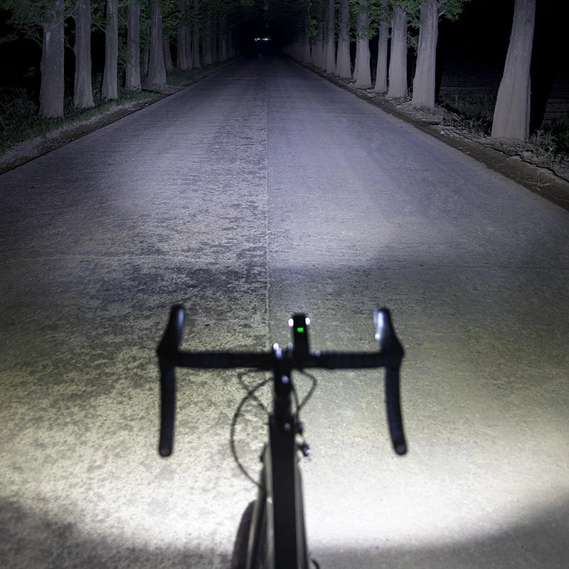 Black aluminum 1000 lumen bike light with USB-C port and dual position handlebar mounting bracket — view 2