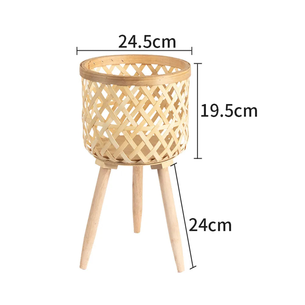 Handmade bamboo woven plant stand with elevated wooden base, displaying a potted green houseplant. — view 2