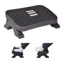 Ergonomic under desk footrest featuring textured massage rollers and angled posture support for office workspaces