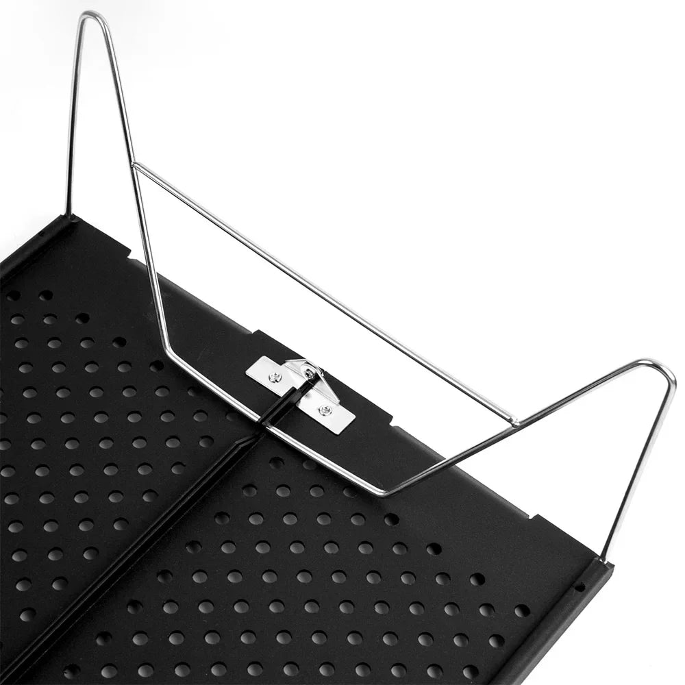 Compact metal folding camping table set up outdoors on green grass for a picnic — view 5