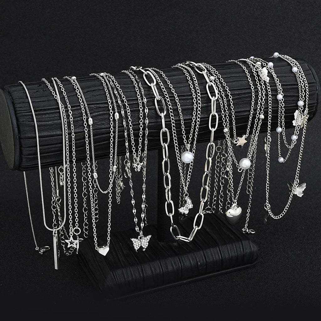 13-piece women's silver tone necklace set featuring heart, star, butterfly, and pearl charm pendants — view 4