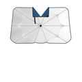 Car windshield sunshade umbrella in white deployed inside a vehicle blocking sunlight