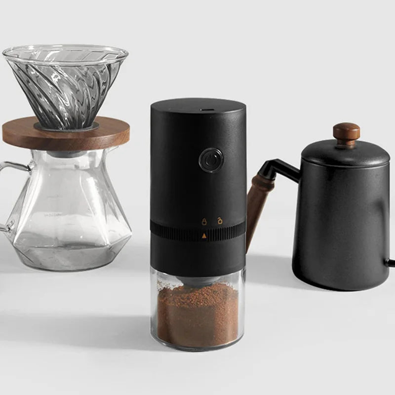Black portable USB-C rechargeable coffee grinder with ceramic burr mill and clear powder chamber — view 3