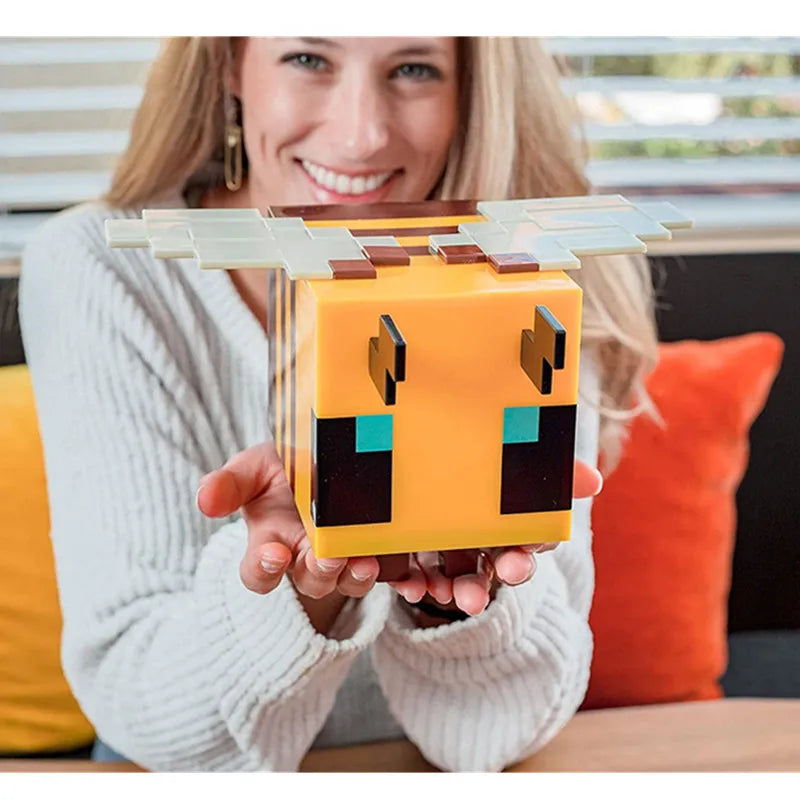 Creative bee night light illuminating a soft LED glow on a child's bedroom bedside table — view 4