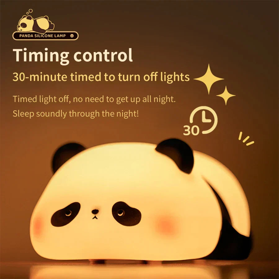 Cute panda silicone LED night light emitting a warm glow on a bedside table — view 5