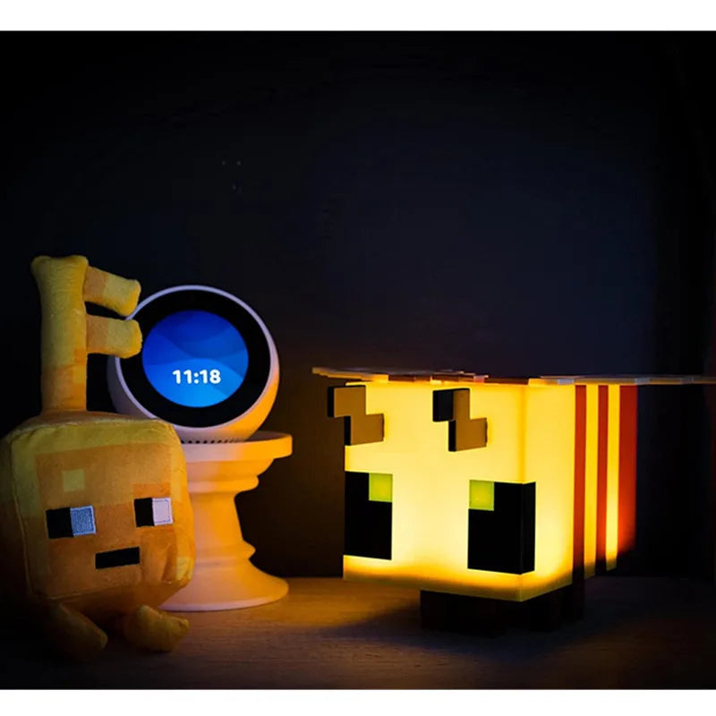 Creative bee night light illuminating a soft LED glow on a child's bedroom bedside table — view 3