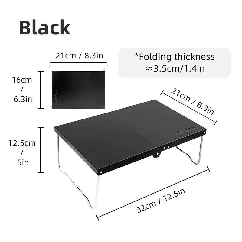 Black portable foldable camping table made of lightweight MDF, set up outdoors — view 5