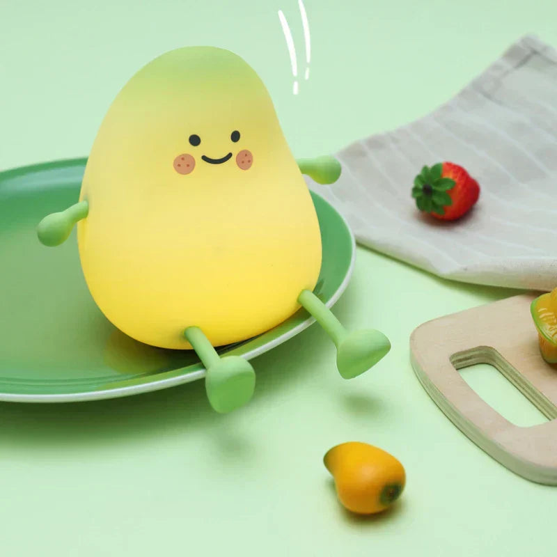 Cute mango night light made of soft silicone emitting a warm glow for bedside decor — view 3