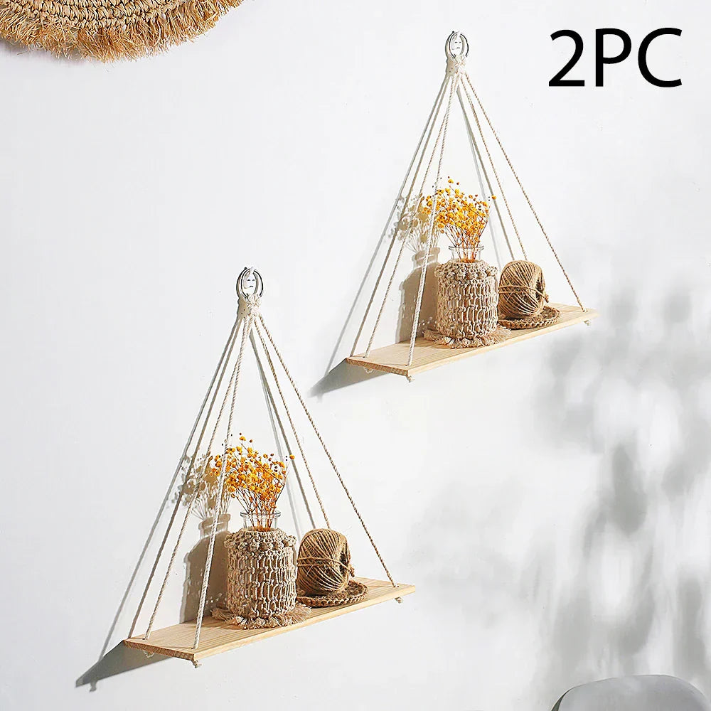 Handmade boho macrame wood wall shelf displaying small plants and home decor items against a wall — view 5