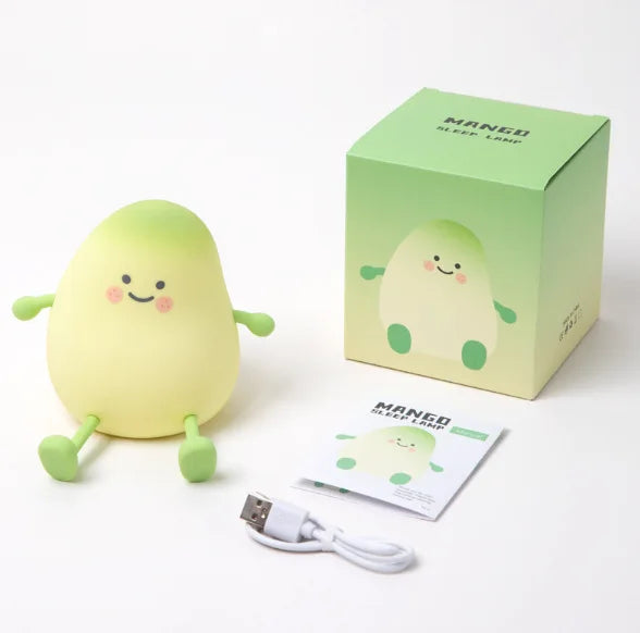 Cute mango night light made of soft silicone emitting a warm glow for bedside decor