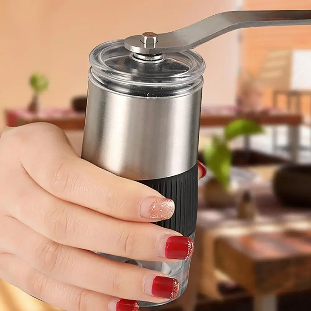 Black manual coffee grinder with hand crank, adjustable ceramic burr, and silicone base — view 4
