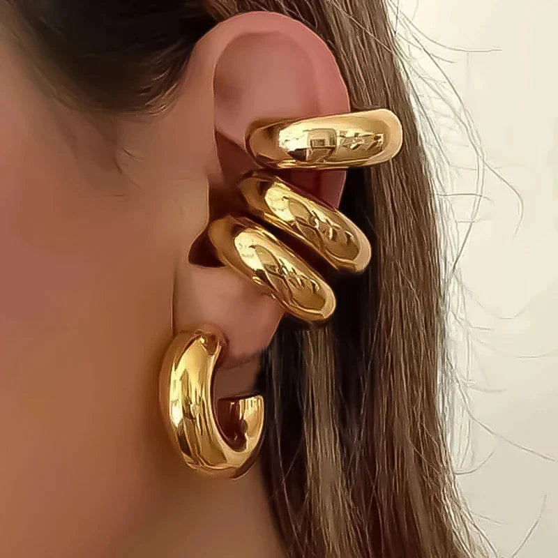 Smooth C-shape clip earrings in gold and silver colors mimicking a cartilage piercing cuff — view 4