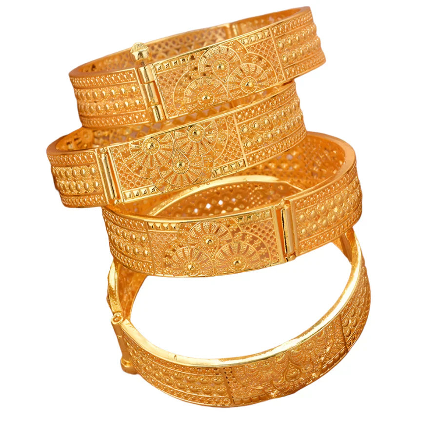 Four-piece gold-plated Ethiopian bangle set featuring intricate geometric designs for women's wedding jewelry.