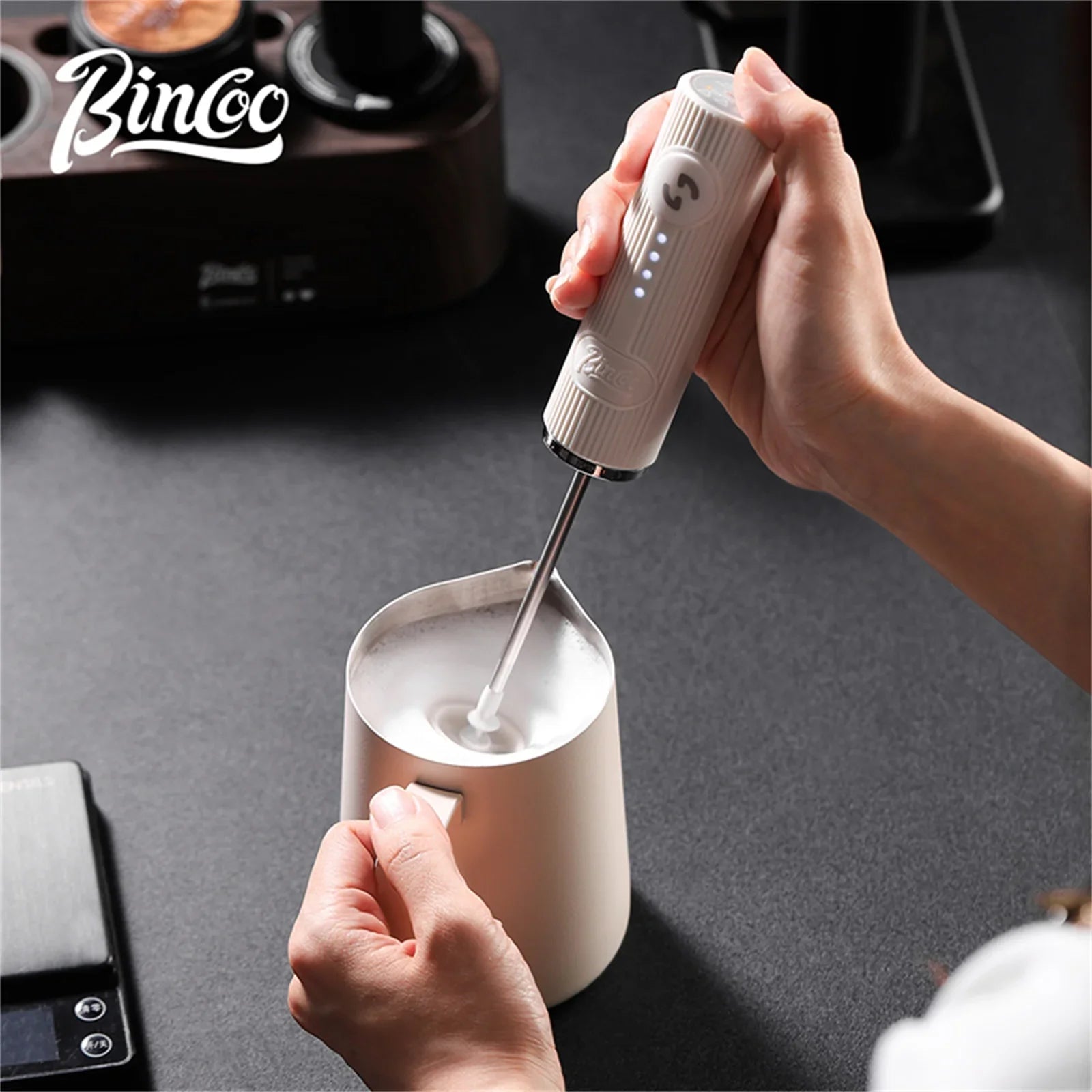 Black wireless electric milk frother with stainless steel whisk head and ergonomic handle — view 5
