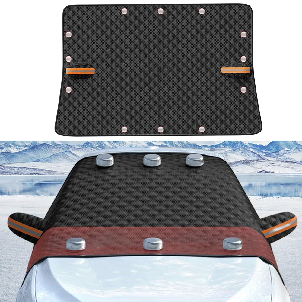 Black magnetic car windshield cover with reflective strips attached to a vehicle in the snow — view 3