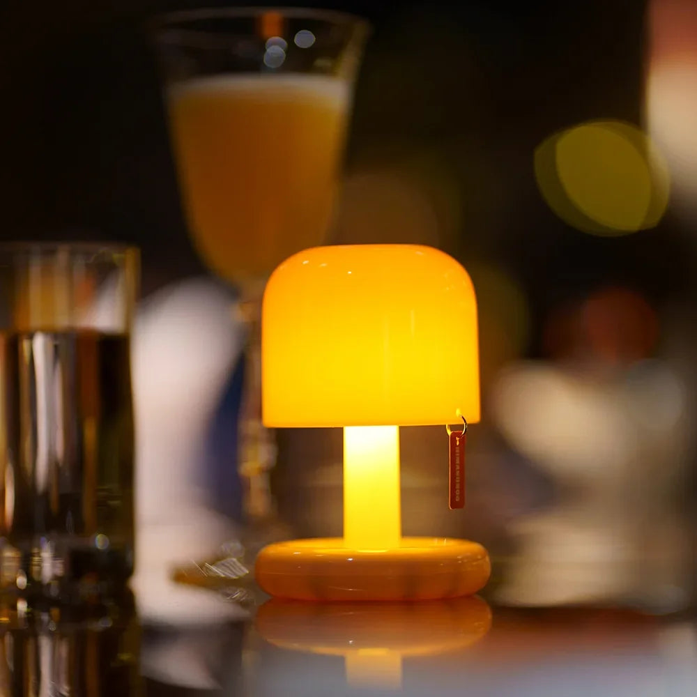 Compact LED mini sunset night light projecting a warm golden glow onto a blank wall — view 3