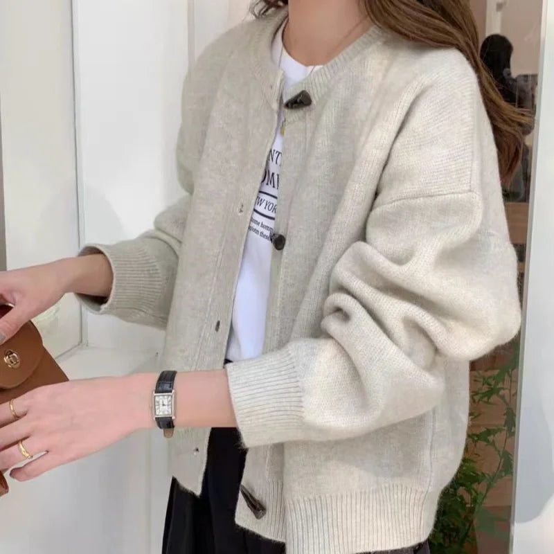 Women's thick wool crew neck button up knitted cardigan sweater in solid color