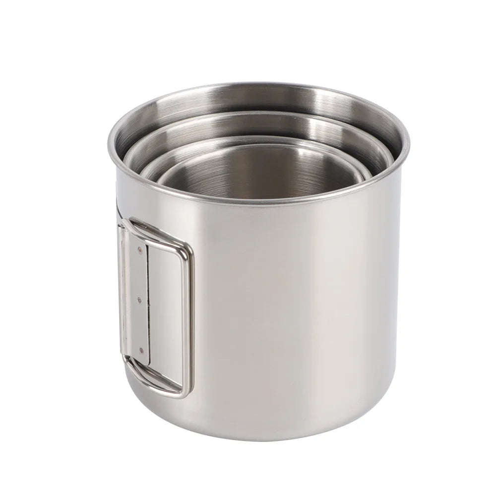Portable stainless steel carabiner camping mug with folding handle for outdoor adventures.