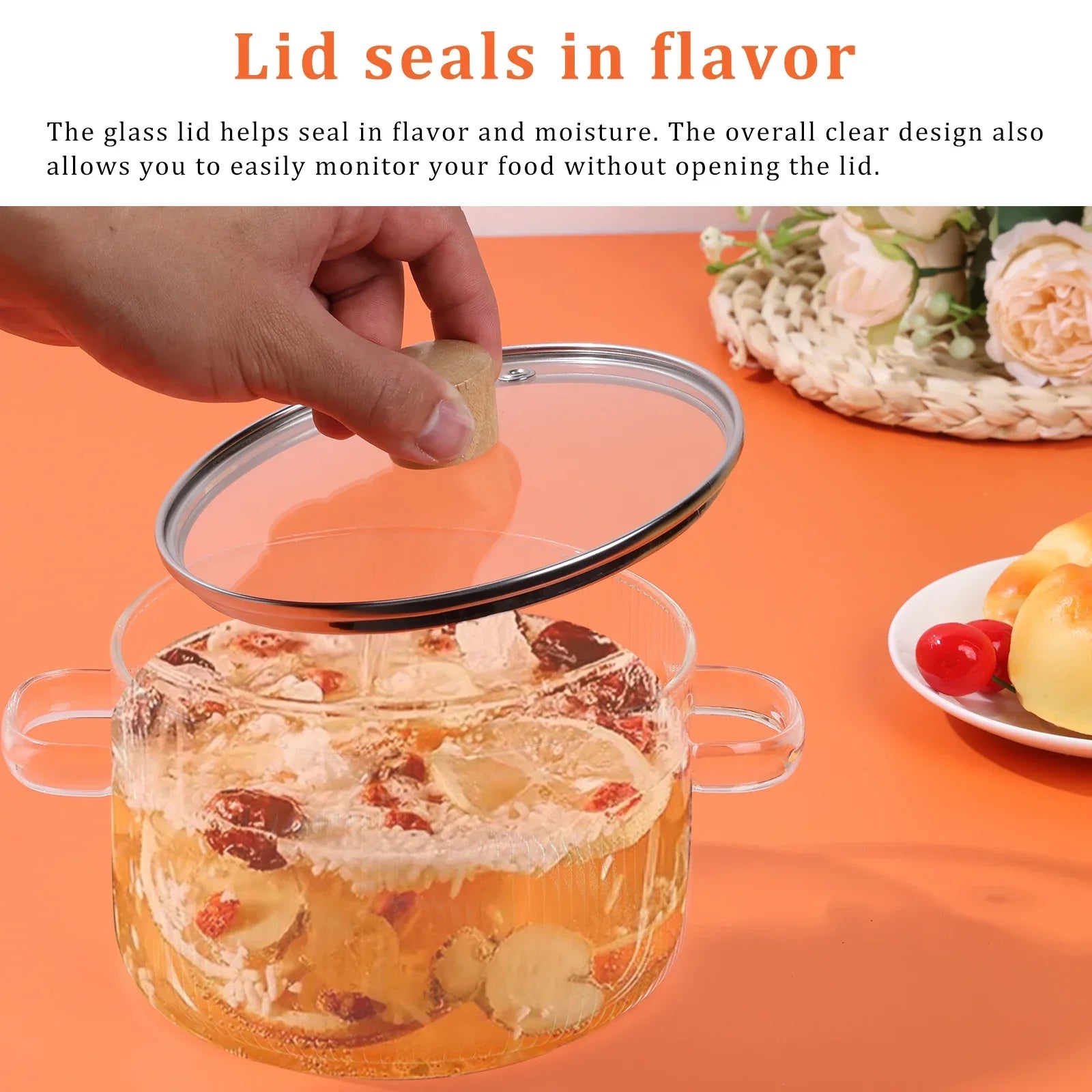 Clear 1.6L borosilicate glass saucepan with matching lid and dual side handles on a stovetop. — view 4