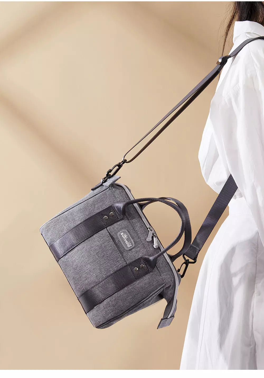 Small crossbody diaper bag in durable polyester with front pocket and bottle holders for modern parents — view 5