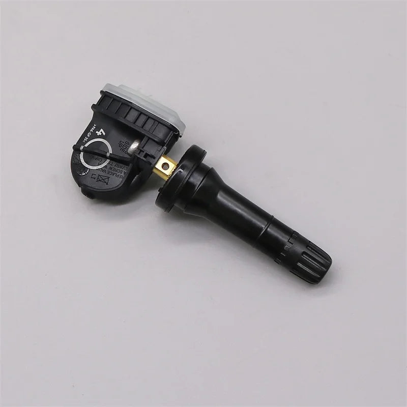 Four black tire pressure monitoring system sensors for vehicle safety and maintenance — view 5