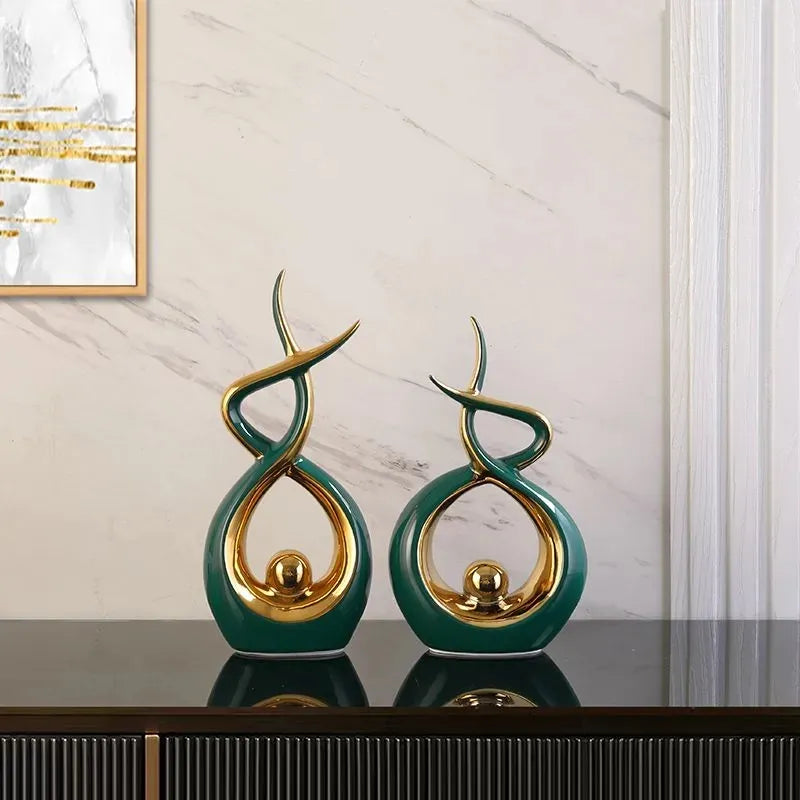 Set of two elegant green abstract resin sculpture statues displayed as modern home decor — view 3
