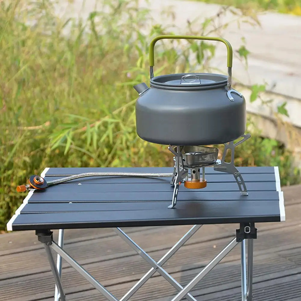 Portable aluminum camping table in silver with black folding bracket and black travel storage bag — view 4