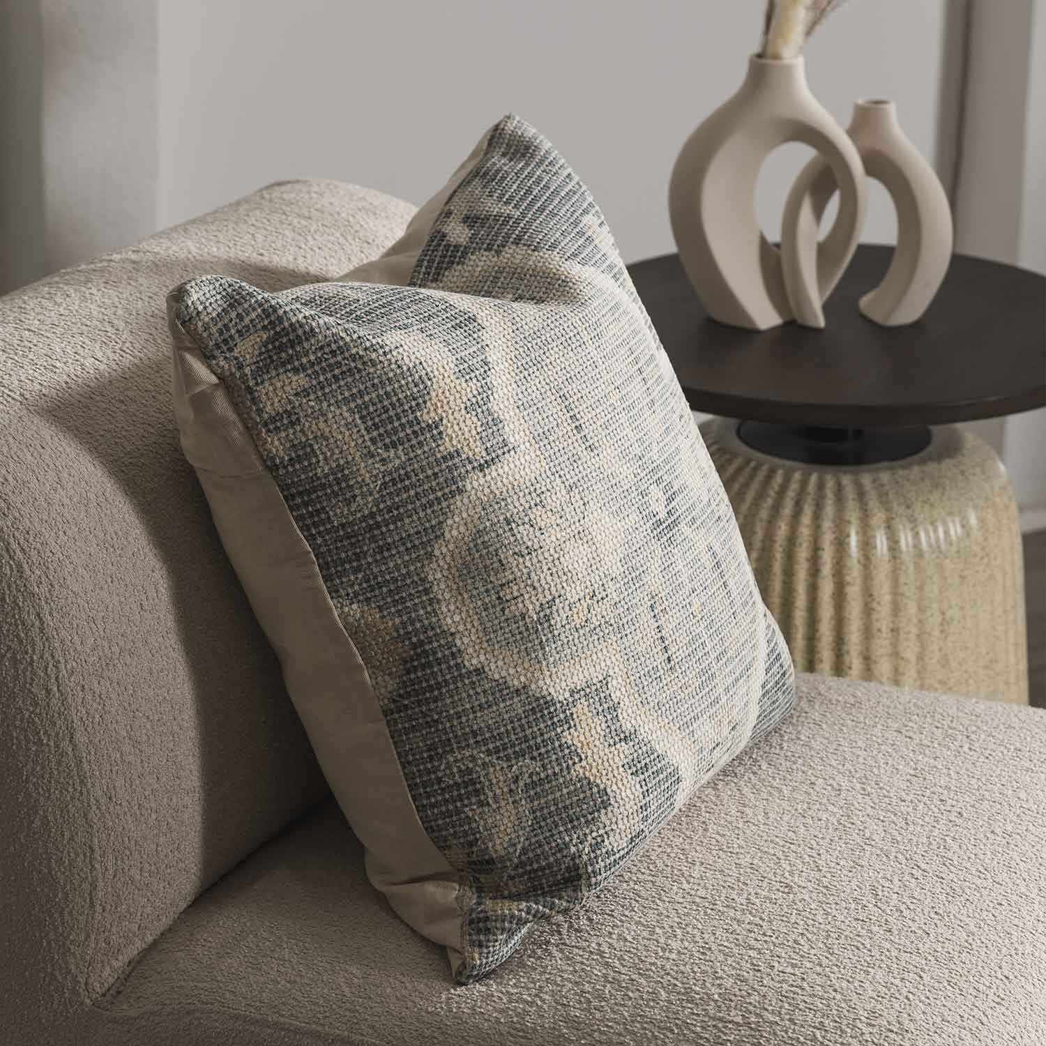 Woven Bigaa throw pillow cover in teal, gray, and peach traditional pattern on a sofa — view 4