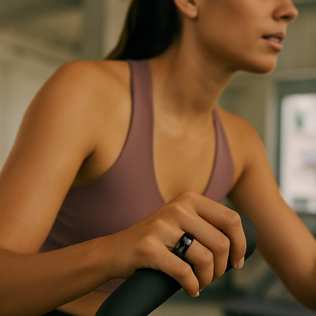 Everyday Wellness Smart Ring in sleek modern finish with its compact magnetic charging base — view 3