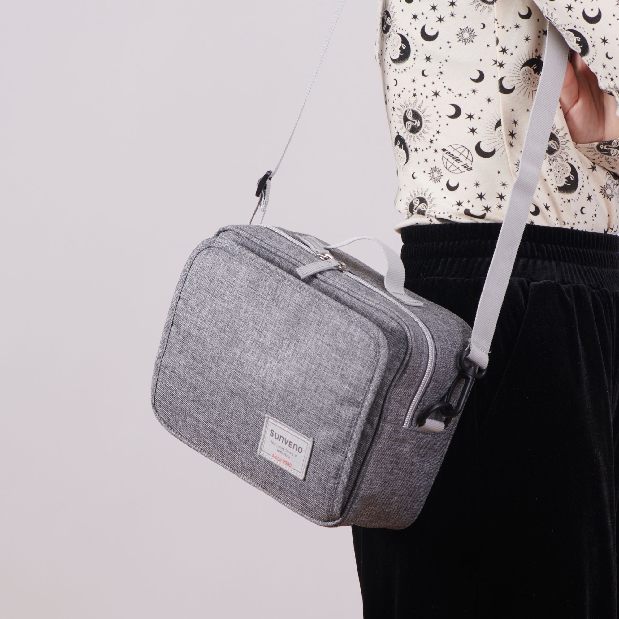 Compact diaper clutch bag with built-in baby wipe dispenser and adjustable shoulder strap for strollers — view 4