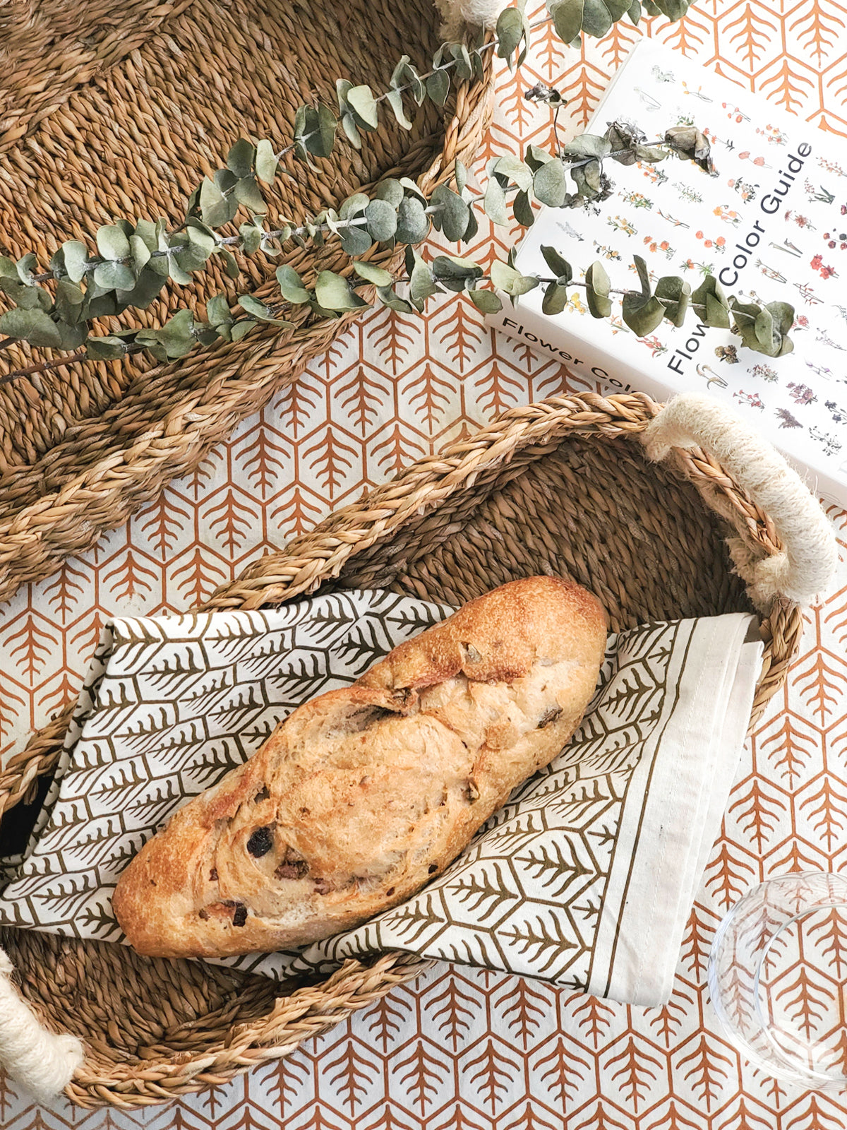 Hand screen-printed tea towel in natural white cotton with brown earthy artisan design patterns — view 2