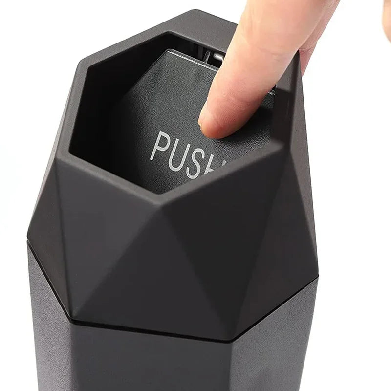 Portable mini car trash can in black with secure lid inside vehicle cup holder — view 4