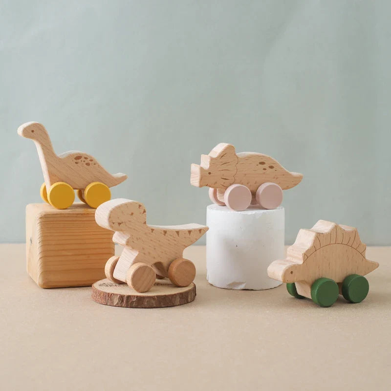 Beech wood Montessori dinosaur toy car with laser engraved details and painted rolling wheels