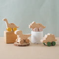 Beech wood Montessori dinosaur toy car with laser engraved details and painted rolling wheels
