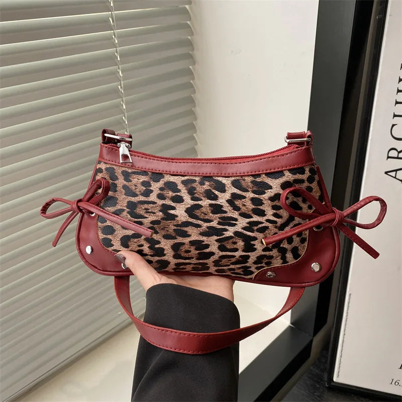 Trendy retro double bow shoulder bag for women featuring a sleek and minimalist underarm silhouette — view 3