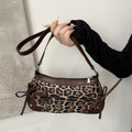 Trendy retro double bow shoulder bag for women featuring a sleek and minimalist underarm silhouette