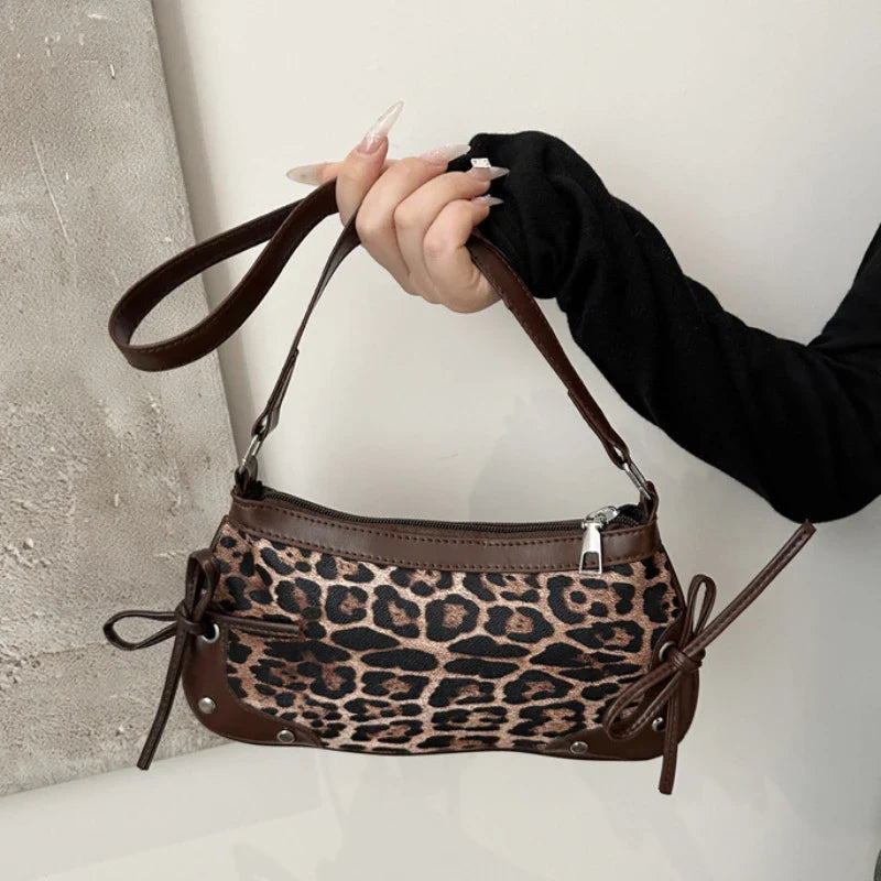 Trendy retro double bow shoulder bag for women featuring a sleek and minimalist underarm silhouette